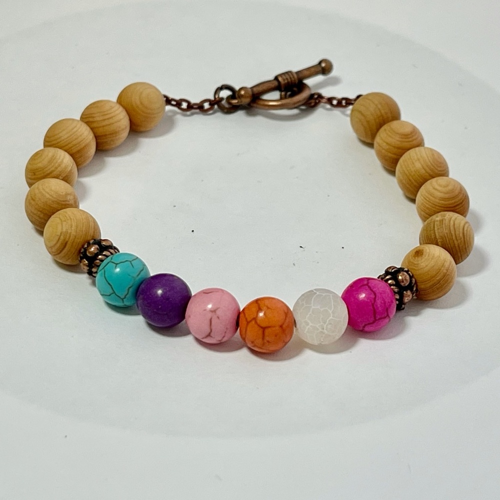 Chakra gem stone bracelet and wooden beads.